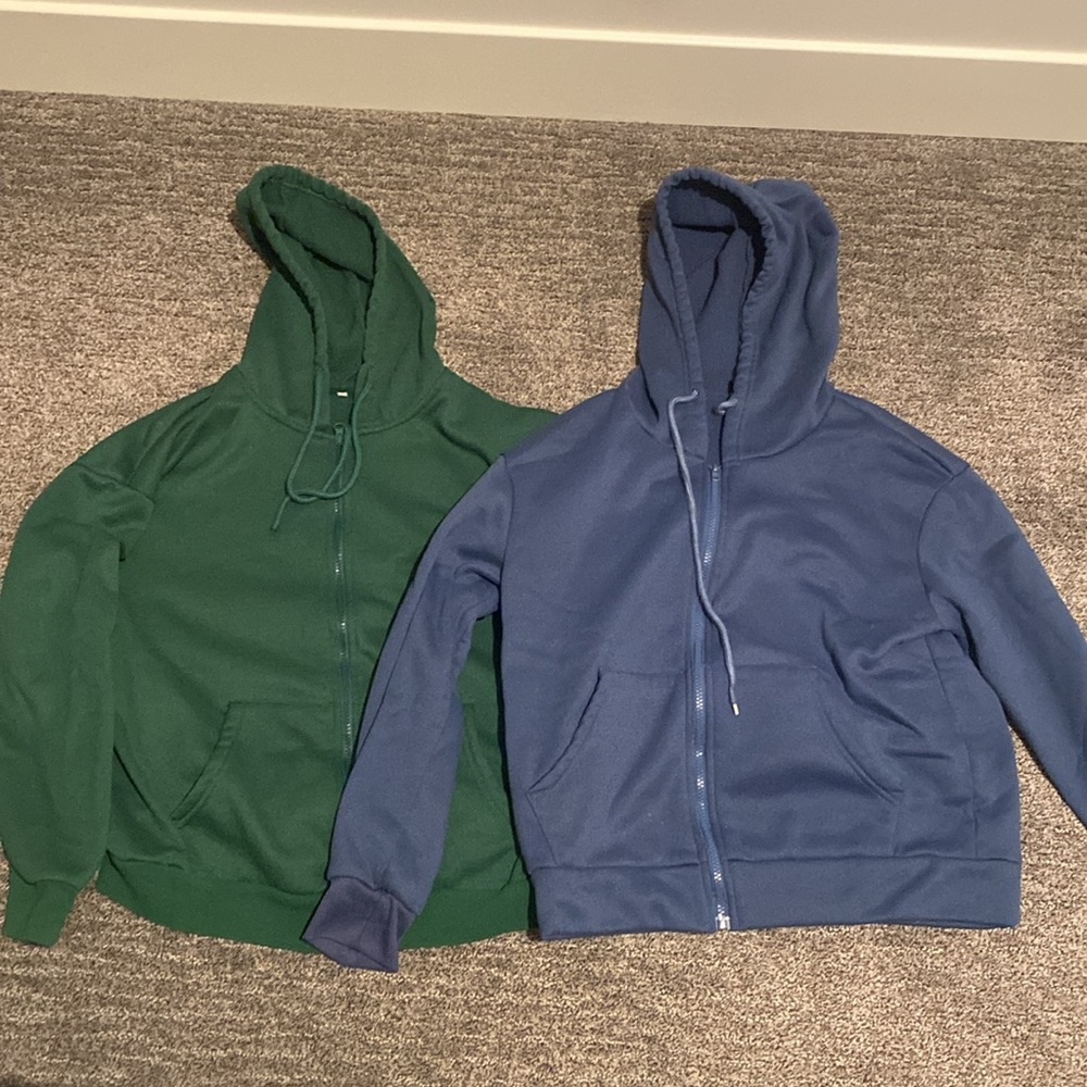 Two medium zip up hoodies green and blue
